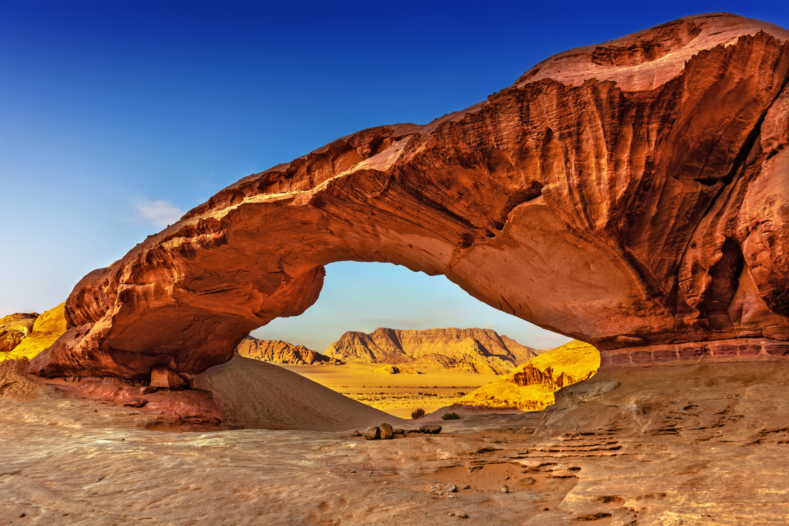 view-through-a-rock-arch-in-the-desert-of-wadi-rum-jordan-middle-east_178038215